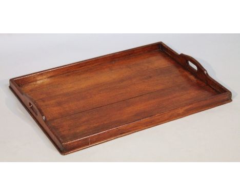 An Edwardian oak tea tray, of rectangular form with a galleried edge set with moulded handle, 7cm high, 68cm wide, 49.5cm dee