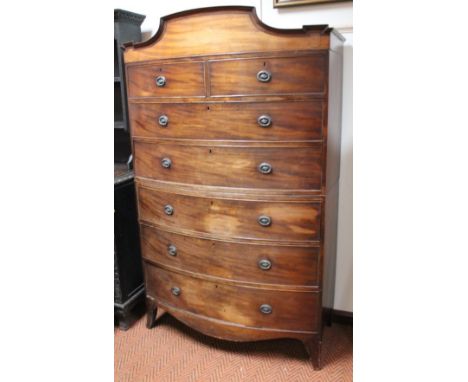 A 19thC mahogany bow fronted tallboy, the fixed moulded cornice raised above two short and five long drawers, each with styli