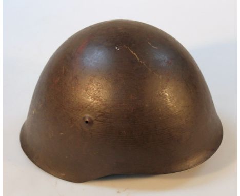 A WWII period steel helmet, possibly Italian