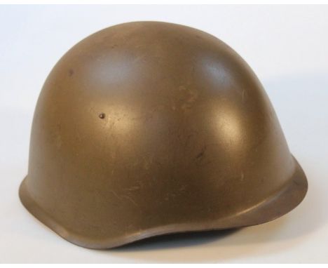 A WWII pattern steel infantry helmet, probably American.