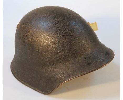 A Swiss infantry steel helmet.