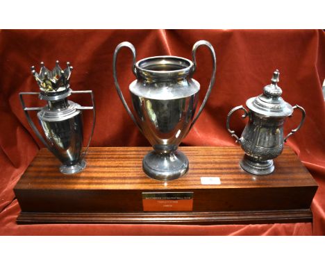 A magnificent trophy arrangement made for Manchester United in mid 1999 celebrating their achievement of winning the Treble i