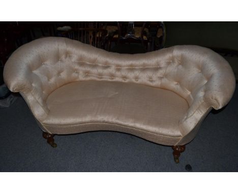 A Victorian walnut framed two-seater sofa, 3rd quarter 19th century, upholstered in button silk damask with rounded arm suppo