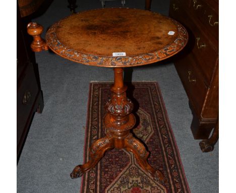 A Victorian figured walnut carved tripod table, 50cm diameter, 73.5cm high CONDITION REPORT: 