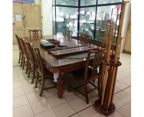 A Hamilton & Tucker mahogany snooker/dining table with six removable leaves, a Hamilton & Tucker scoreboard, a cue stand and 