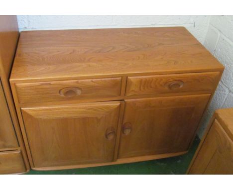 An Ercol Golden Dawn small sideboard two drawers and two cupboards