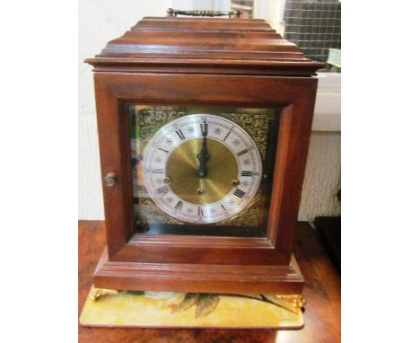A bracket clock with eight day chiming movement