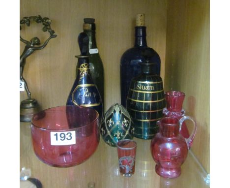 A Bristol blue glass Rum decanter, another Green Shrub decanter, other bottles and coloured glass
