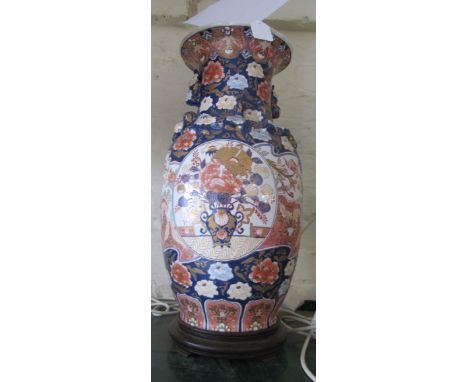 A blue ground oriental vase with reserves of flowers and birds gilt detail, converted to a lamp (foot loose)