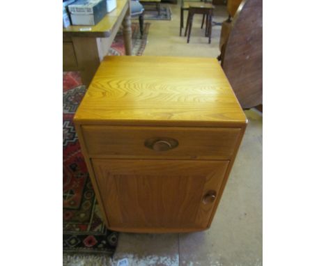 A pair of Ercol Golden Dawn single door cabinets