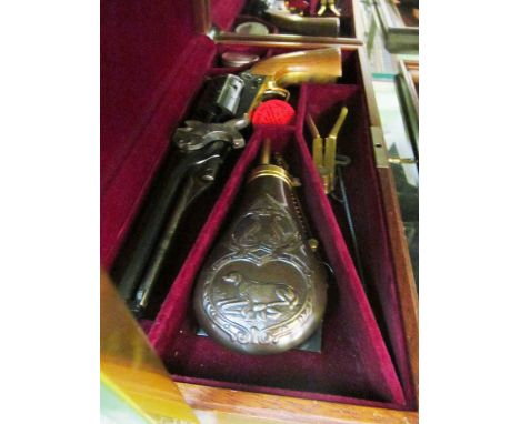 A Wyatt Earp mounted reproduction revolver, boxed reproduction revolver with powder flask et cetera and a boxed reproduction 
