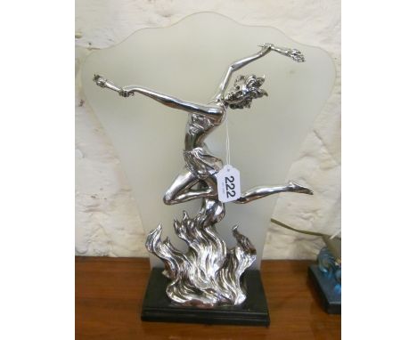 A lamp lady with torch jumping through flames