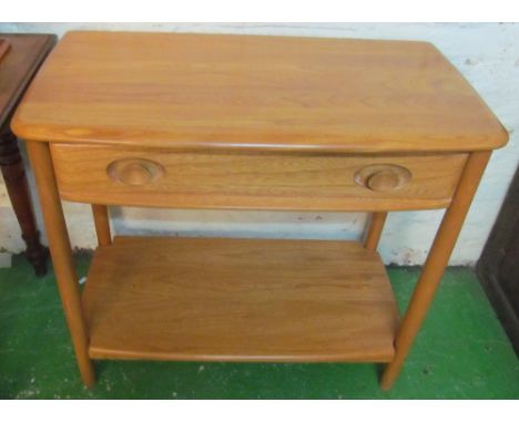 An Ercol Golden Dawn side table with drawer and undertier