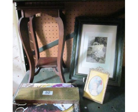 A small table, print 'Pick a Book', miniature 17th Century lady and a cribbage board