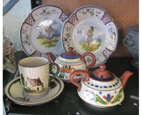 Two Quimper pottery plates and three items of motto ware