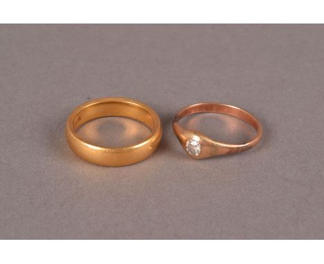 A vintage 22ct gold wedding band, approx 7.5g and size N, together with an Edwardian gold and diamond solitaire ring, approx 