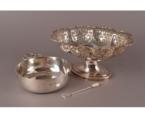 A Victorian silver tastevin bowl by BB, having applied pierced circle design handle and engraved initials, London 1881, toget