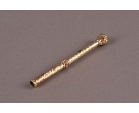 A gold Victorian retractable pencil, with engine turned barrel and slide out pencil, having carnelian intaglio seal terminal 