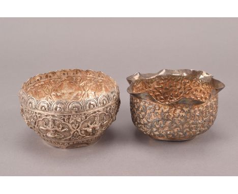 Two vintage Middle Eastern white metal bowls or sugar basins, one example with panels of deities, the other with ornate scrol
