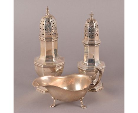Two early 20th century silver sugar sifters and a sauce boat, one sifter by Henry Wilkinson dated London 1901, the other sift