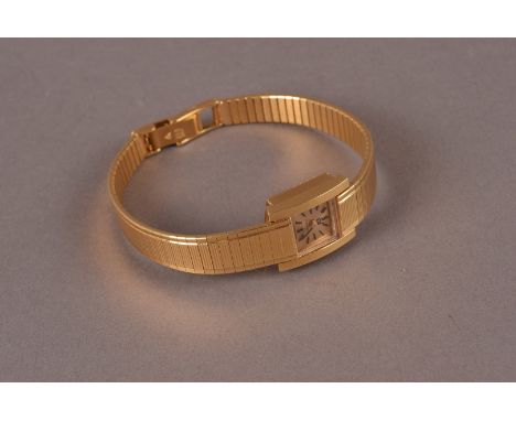 An Omega ladies 18ct gold wristwatch, the vintage ladies watch with baton numerals and vintage strap with logo marked clasp, 