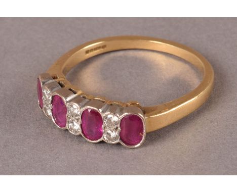 A modern ruby and diamond dress ring, having four oval cut red stones alternately set with pairs of brilliant cuts, hallmarke