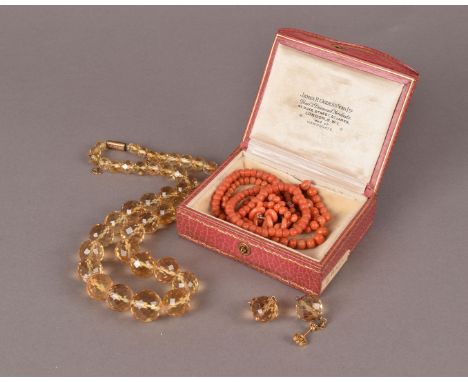 A vintage citrine bead necklace and earrings, together with two child’s vintage coral bead necklaces and three coral studs, w