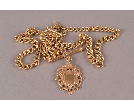 A vintage 9ct gold watch chain and fob, the graduating curb link chain with T bar and snap clasp, mounted with a pierced fob 