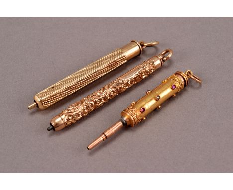 A group of three late Victorian yellow metal fob pencils, including an engine turned S. Mordan & Co example, a jewelled fob p