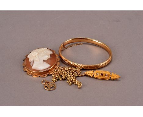 A 9ct gold mounted carved shell cameo brooch, together with a 15ct gold ruby and pearl brooch, a 9ct gold Gemini pendant, a d