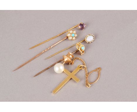 An 18ct gold cross pendant and four gem set stick pins, together with a pearl tie pin and a stick pin box (6) 