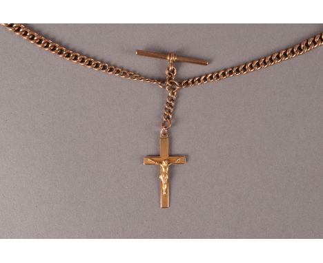 A vintage 9ct gold double Albert watch chain, graduating curb link chains with T bar and supporting a 9ct gold crucifix penda