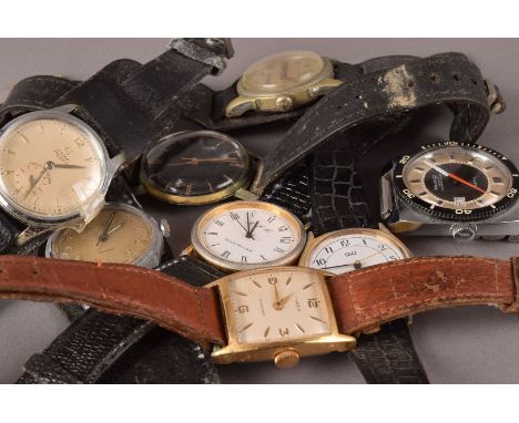 A group of eight vintage and modern gentlemens wristwatches, including a retro 1970s Timex example and others on leather stra
