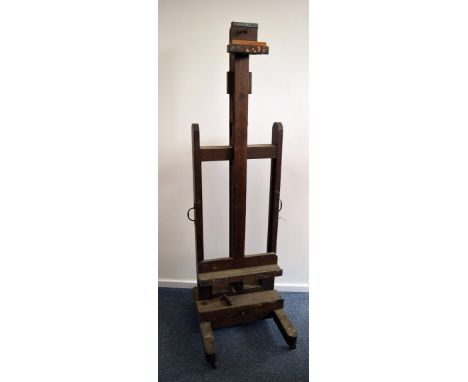 A vintage oak artist’s / restorer’s easel, the double sided stand with screw mechanism lower lifting section and upright with