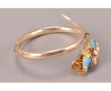 A pretty Victorian serpant bangle, having turquoise enamel to the head and set with pink stones and pearls, with engraved to 