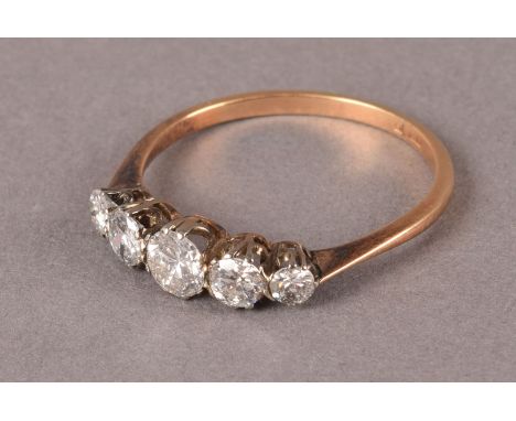 A vintage five stone diamond engagement ring, having graduating modern brilliant cuts in an 18ct gold mount, approx 1.9g and 