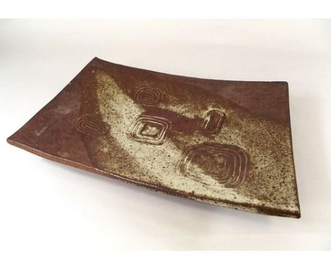 JANET LEACH. 
A Janet Leach shaped rectangular, twin-footed dish. Impressed personal & Leach Pottery marks. 28 x 39cm.


