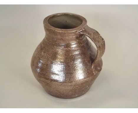 LEACH POTTERY.
A Leach Pottery salt-glaze, medieval style pitcher. Leach Pottery mark & unidentified 'L' personal seal. Heigh