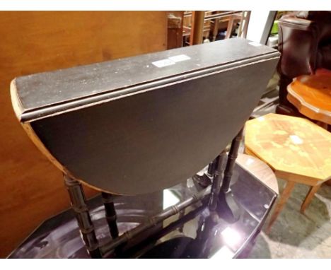 Small mahogany dropleaf oval table with ceramic castors. Not available for in-house P&amp;P 