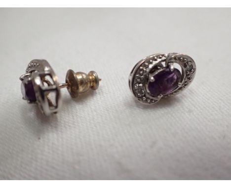 Pair of 9ct gold amethyst and diamond stud earrings. UK P&amp;P Group 1 (£16+VAT for the first lot and £2+VAT for subsequent 