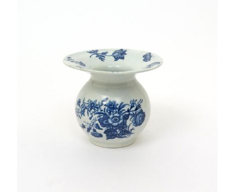 A Worcester blue and white spittoon  c.1770, printed with the Three Flowers pattern, the reverse and wide rim with scattered 