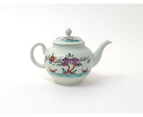 A Worcester teapot and cover  c.1765, of small globular form, finely painted in the famille rose manner with a bird in flight