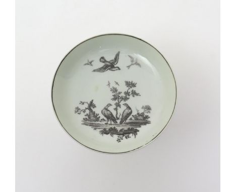 A Worcester ornithological saucer  c.1760, printed in black with a pair of doves perched on the ground either side of a small
