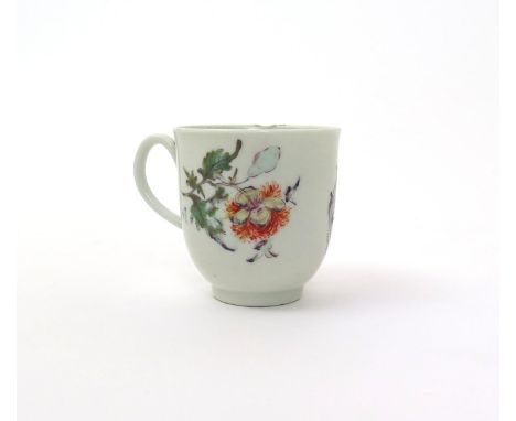 A rare Worcester 'trial' coffee cup  c.1768-70, painted with an armorial shield within simple purple scrollwork, to either si