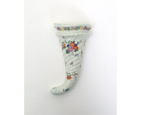 A rare Worcester cornucopia wall pocket  c.1755-58, the traditional spiral-moulded horn shape with a moulded floral border to