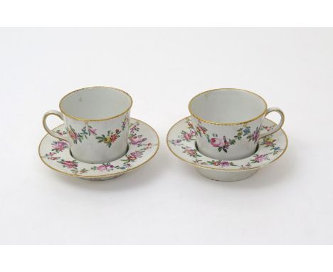 A pair of Derby chocolate cups and trembleuse saucers  c.1775-80, the flared cups with simple loop handles, all painted in th