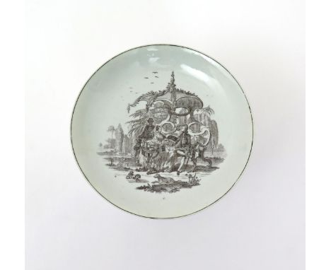 A rare Worcester saucer dish  c.1760, printed in black with an unusual variation on the Tea Party design, a couple seated on 