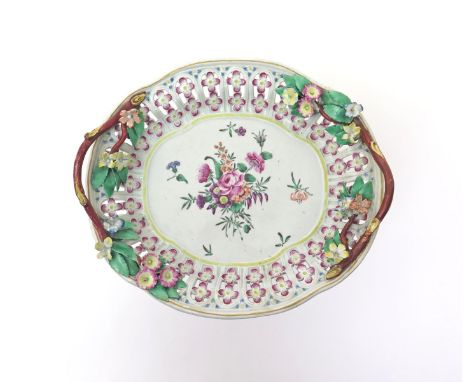 A Worcester chestnut basket stand  c.1770-75, of quatrefoil form, the well painted with a bright flower spray, the rim reticu