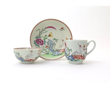 A Worcester trio  c.1760-65, decorated in the famille rose palette after a Chinese original with a crane standing before a fe