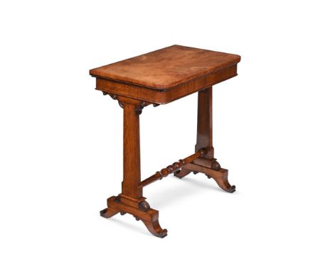 A REGENCY FIGURED OAK AND OAK FOLDING GAMES OR WRITING TABLE IN THE MANNER OF GEORGE BULLOCK, CIRCA 1815 The book-matched top